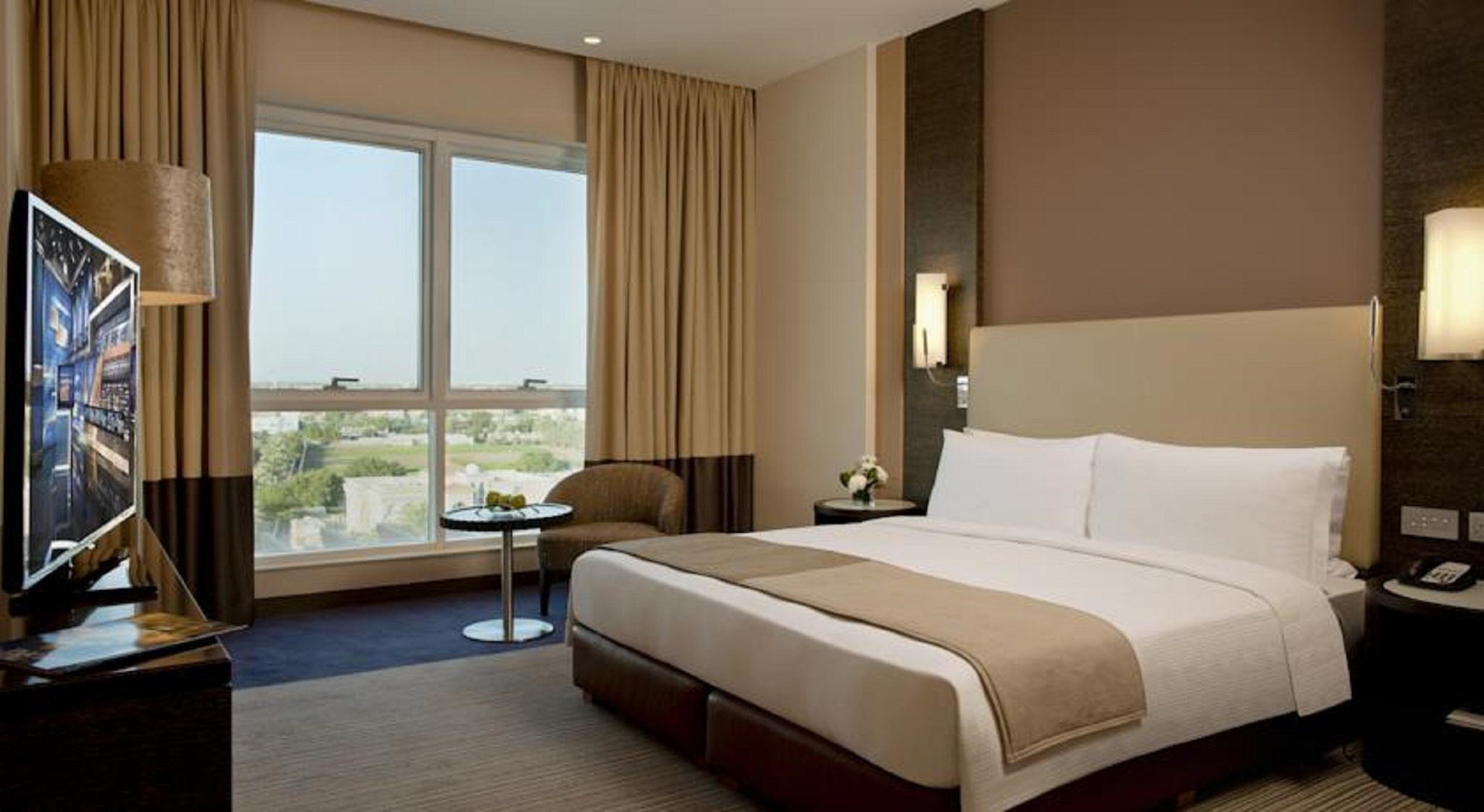 Four Points By Sheraton Al Ain Luaran gambar A bedroom at the hotel